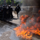 Illustration for article titled Paris Taxi Drivers Burn Cars in Violent Anti-Uber Riot